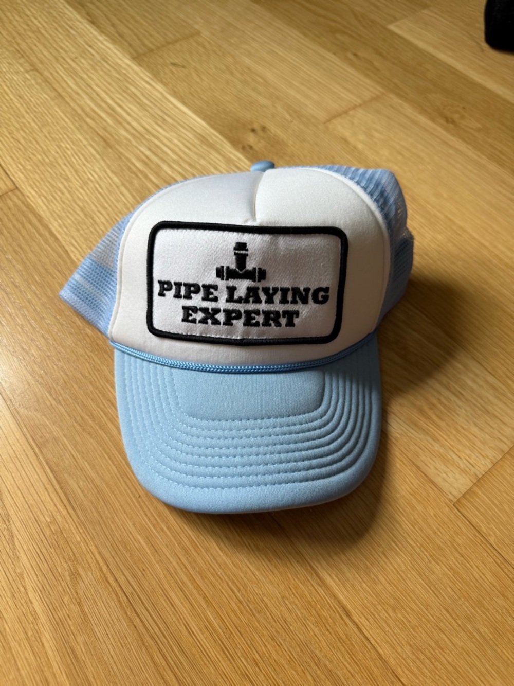 Pipe Laying Expert Patch Trucker Hat - Light Blue & White